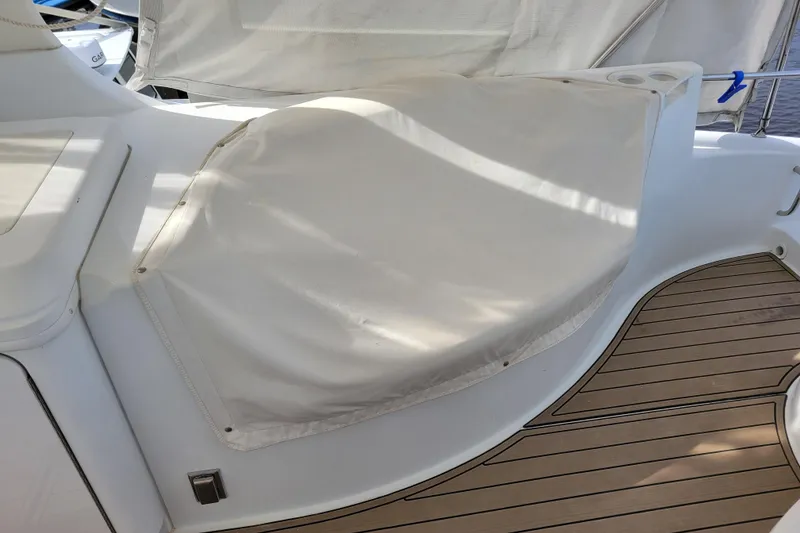 Slide: The Image of Covered seating area on 2001 Carver 570 Voyager Pilothouse yacht deck. - 120