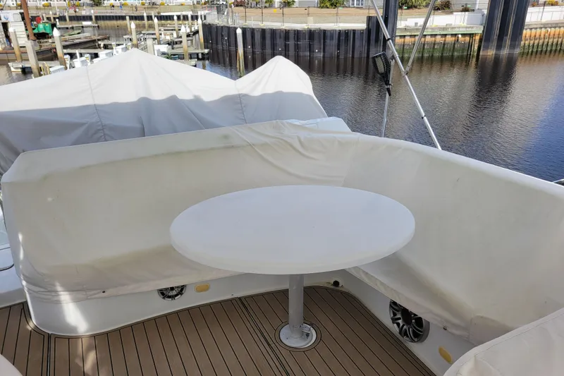 Slide: The Image of Covered seating area on a 2001 Carver 570 Voyager Pilothouse yacht, docked by the water. - 121