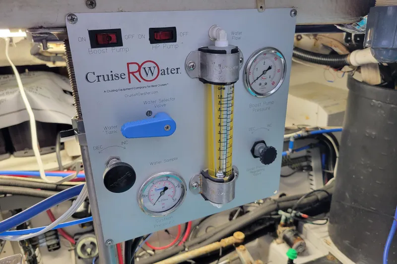 Slide: The Image of Control panel of a 2001 Carver 570 Voyager Pilothouse with gauges and switches. - 128