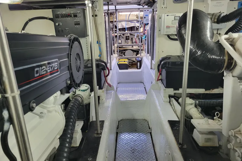 Slide: The Image of Engine room of a 2001 Carver 570 Voyager Pilothouse with D12-675 engine. - 131