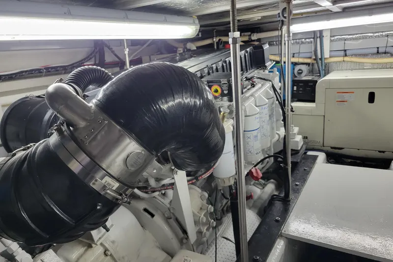 Slide: The Image of Engine room of 2001 Carver 570 Voyager Pilothouse with visible machinery and components. - 134