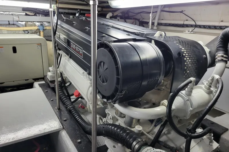 Slide: The Image of Engine room of 2001 Carver 570 Voyager Pilothouse with detailed machinery view. - 135