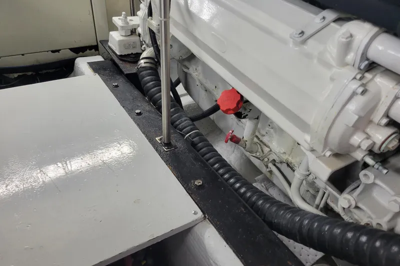 Slide: The Image of Engine compartment of a 2001 Carver 570 Voyager Pilothouse with visible components. - 137