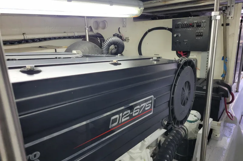 Slide: The Image of Engine room of 2001 Carver 570 Voyager Pilothouse with D12-675 engine. - 142
