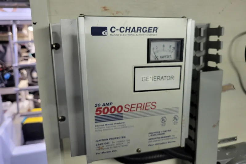 Slide: The Image of C-Charger 5000 Series marine battery charger in a 2001 Carver 570 Voyager Pilothouse. - 147
