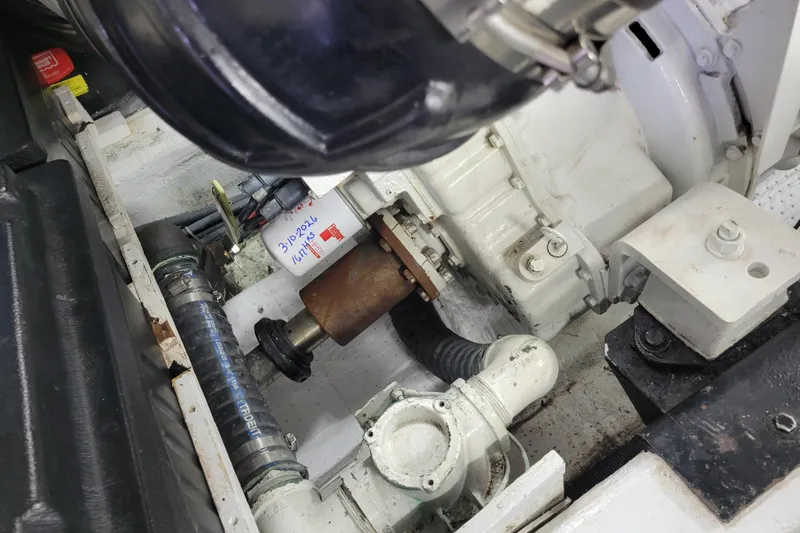 Slide: The Image of Engine compartment of a 2001 Carver 570 Voyager Pilothouse, showcasing mechanical components. - 149