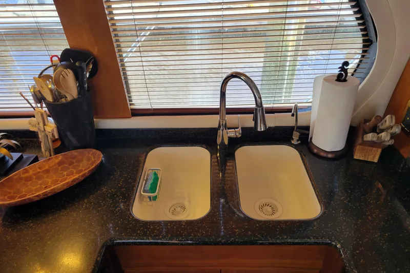 Slide: The Image of Kitchen sink area on a 2001 Carver 570 Voyager Pilothouse yacht. - 15