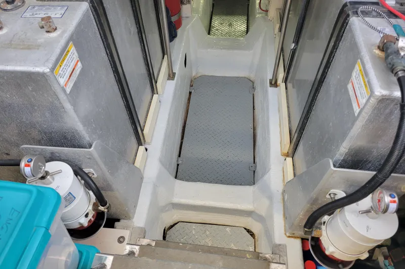 Slide: The Image of Engine room of 2001 Carver 570 Voyager Pilothouse with fuel tanks and equipment. - 159