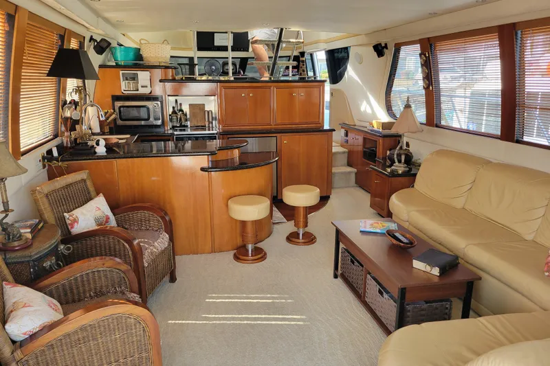 Slide: The Image of Luxurious interior of 2001 Carver 570 Voyager Pilothouse with modern kitchen and cozy seating. - 2