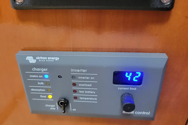 Slide: The Image of Victron Energy control panel on 2001 Carver 570 Voyager Pilothouse, displaying current limit. - 23