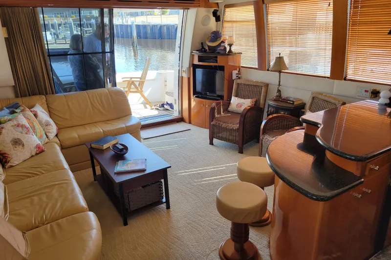 Slide: The Image of Luxurious interior of 2001 Carver 570 Voyager Pilothouse yacht with cozy seating and elegant decor. - 3