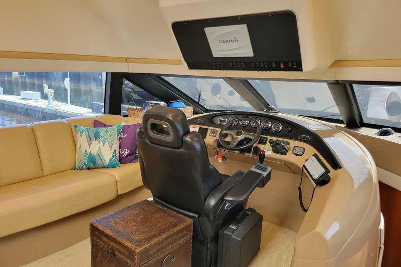 Slide: The Image of Pilothouse interior of 2001 Carver 570 Voyager with leather seating and Garmin navigation system. - 30