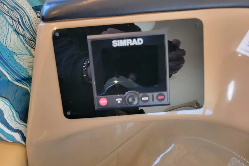 Slide: The Image of Simrad navigation system on 2001 Carver 570 Voyager Pilothouse dashboard. - 34