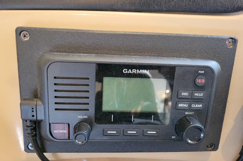 Slide: The Image of Garmin marine radio on 2001 Carver 570 Voyager Pilothouse dashboard. - 35