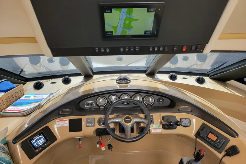 Slide: The Image of Interior view of 2001 Carver 570 Voyager Pilothouse helm with navigation equipment. - 36