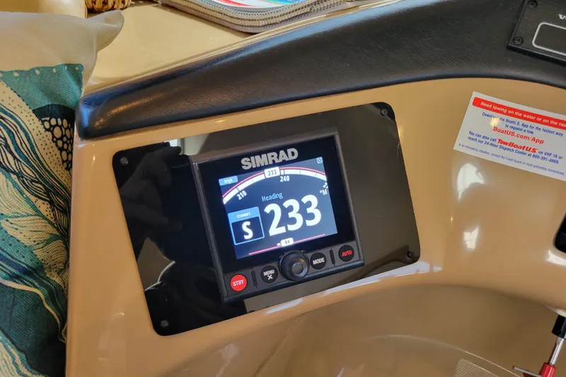 Slide: The Image of Simrad navigation display on 2001 Carver 570 Voyager Pilothouse showing heading 233 degrees. - 38