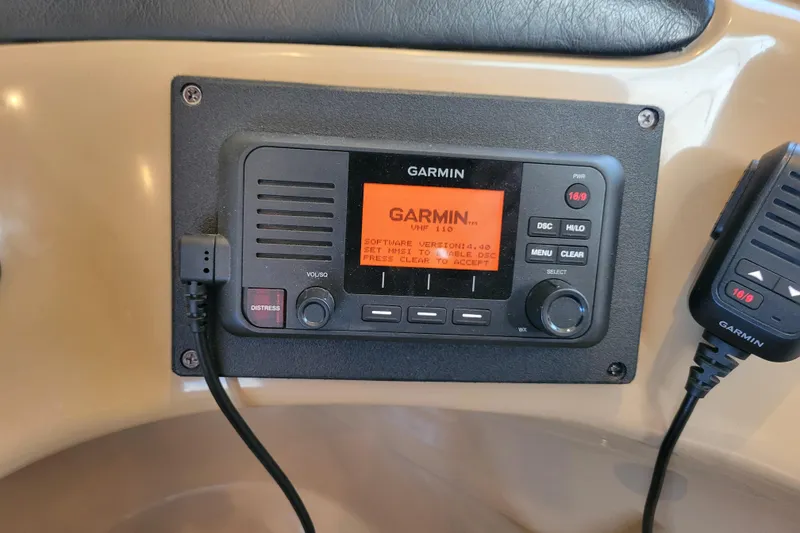 Slide: The Image of Garmin VHF 110 radio on 2001 Carver 570 Voyager Pilothouse dashboard. - 39