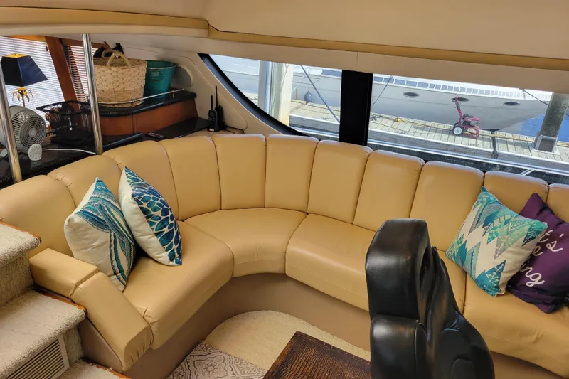 Slide: The Image of Luxurious interior of 2001 Carver 570 Voyager Pilothouse with plush seating and decorative pillows. - 41