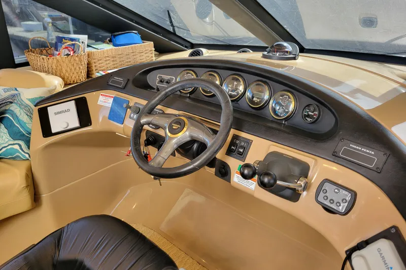 Slide: The Image of Interior helm of 2001 Carver 570 Voyager Pilothouse with steering wheel and navigation instruments. - 43