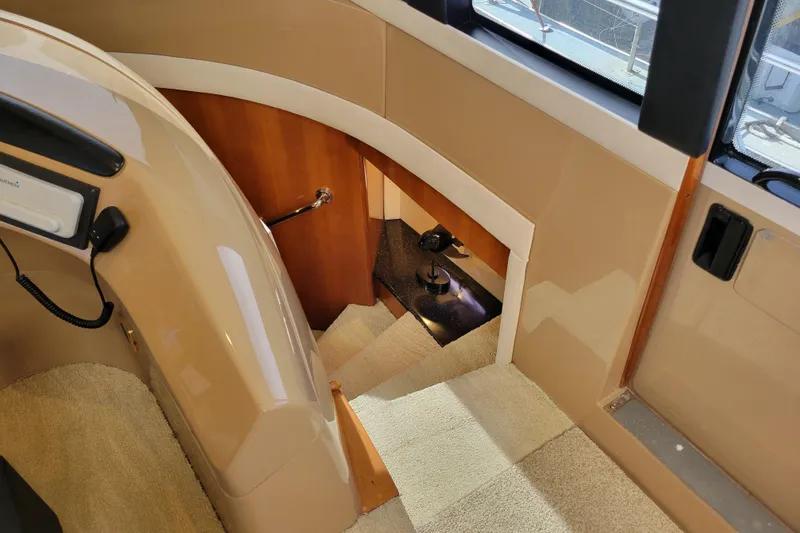 Slide: The Image of Interior view of 2001 Carver 570 Voyager Pilothouse, featuring stairs and elegant design. - 48