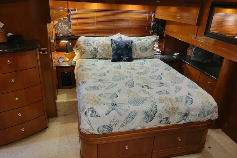 Slide: The Image of Luxurious bedroom in 2001 Carver 570 Voyager Pilothouse with nautical-themed bedding. - 51