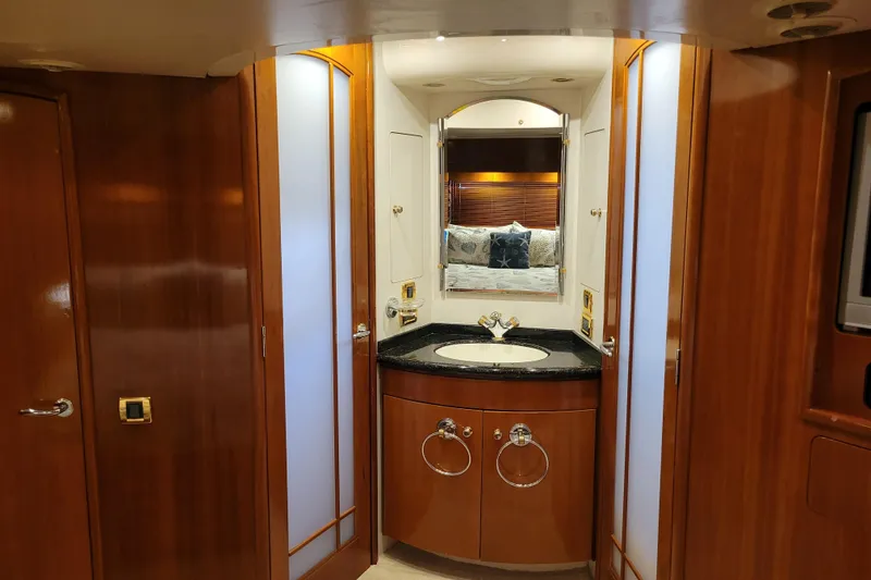 Slide: The Image of Luxurious bathroom interior of 2001 Carver 570 Voyager Pilothouse yacht with wood accents. - 55