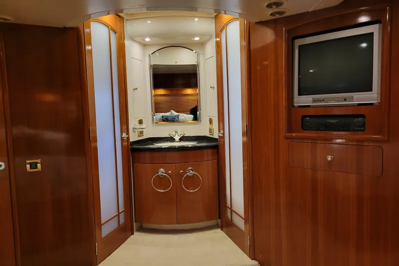 Slide: The Image of Luxurious interior of 2001 Carver 570 Voyager Pilothouse with wood paneling and built-in TV. - 56