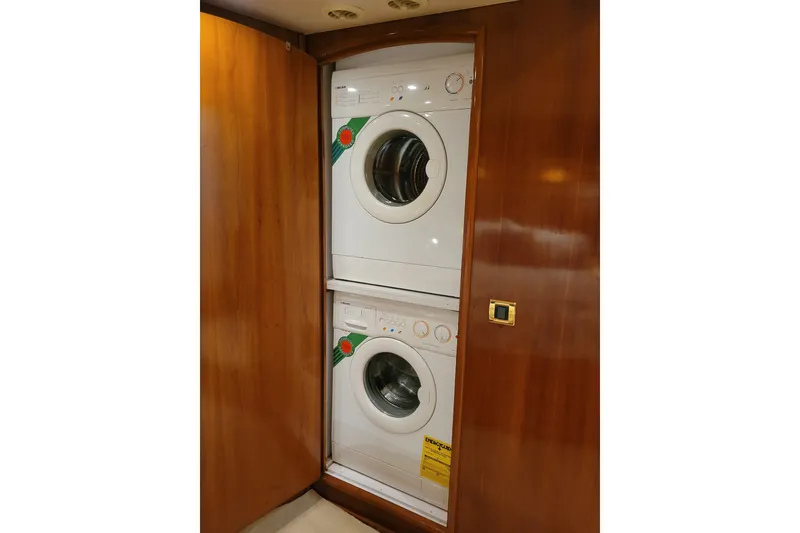Slide: The Image of Stacked washer and dryer in 2001 Carver 570 Voyager Pilothouse yacht interior. - 58