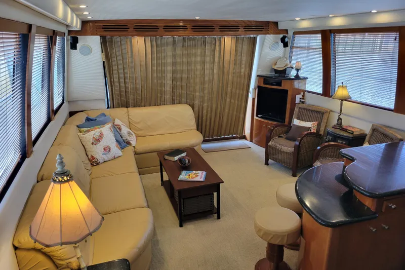 Slide: The Image of Luxurious interior of 2001 Carver 570 Voyager Pilothouse yacht with cozy seating and elegant decor. - 6