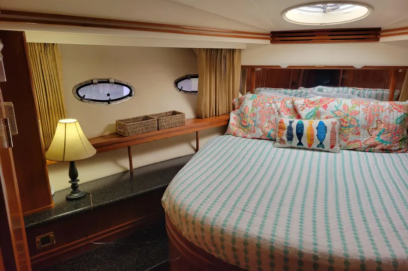 Slide: The Image of Luxurious bedroom in 2001 Carver 570 Voyager Pilothouse yacht with cozy decor. - 64