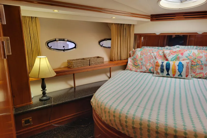 Slide: The Image of Cozy bedroom in 2001 Carver 570 Voyager Pilothouse with nautical decor and soft lighting. - 67