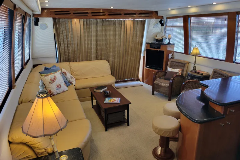 Slide: The Image of Luxurious interior of 2001 Carver 570 Voyager Pilothouse with cozy seating and elegant decor. - 7