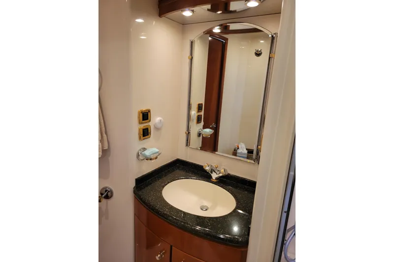Slide: The Image of Luxurious bathroom in 2001 Carver 570 Voyager Pilothouse with elegant sink and mirror. - 73