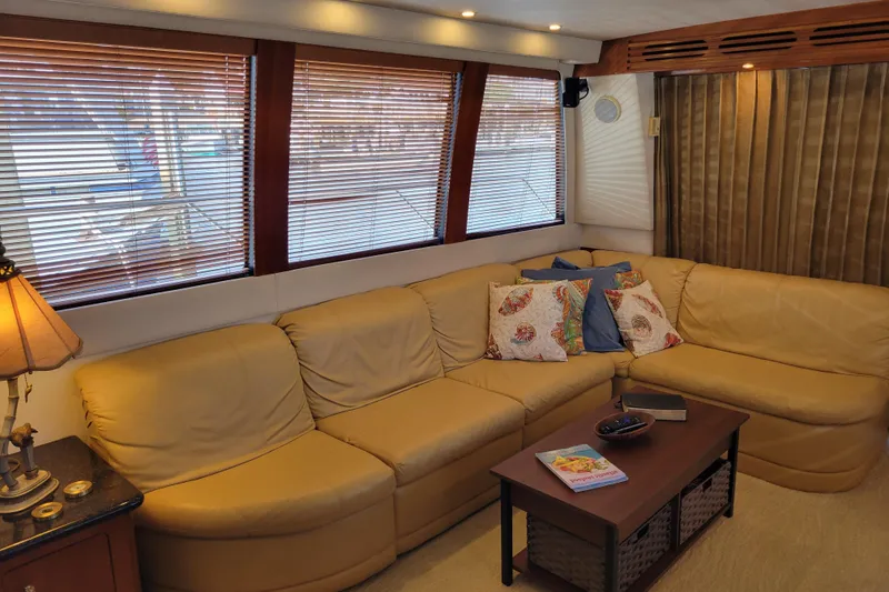 Slide: The Image of Luxurious interior of 2001 Carver 570 Voyager Pilothouse with beige leather seating. - 8