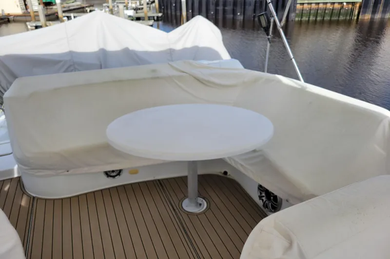 Slide: The Image of Covered seating area on 2001 Carver 570 Voyager Pilothouse yacht deck. - 81
