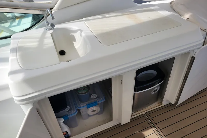 Slide: The Image of Outdoor sink and storage on 2001 Carver 570 Voyager Pilothouse yacht deck. - 83