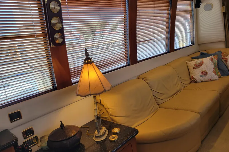 Slide: The Image of Luxurious interior of 2001 Carver 570 Voyager Pilothouse with cozy seating and elegant decor. - 9