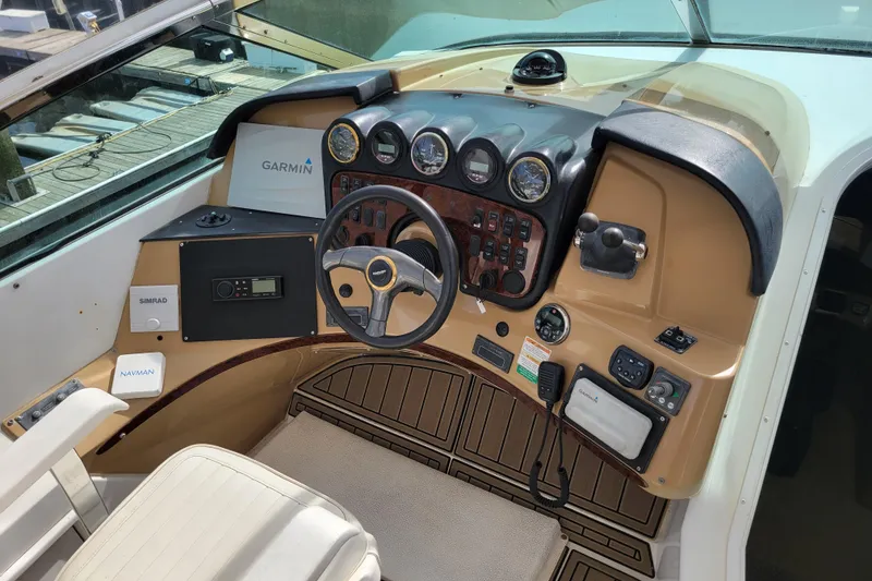 Slide: The Image of Pilothouse interior of 2001 Carver 570 Voyager with navigation equipment and steering controls. - 92
