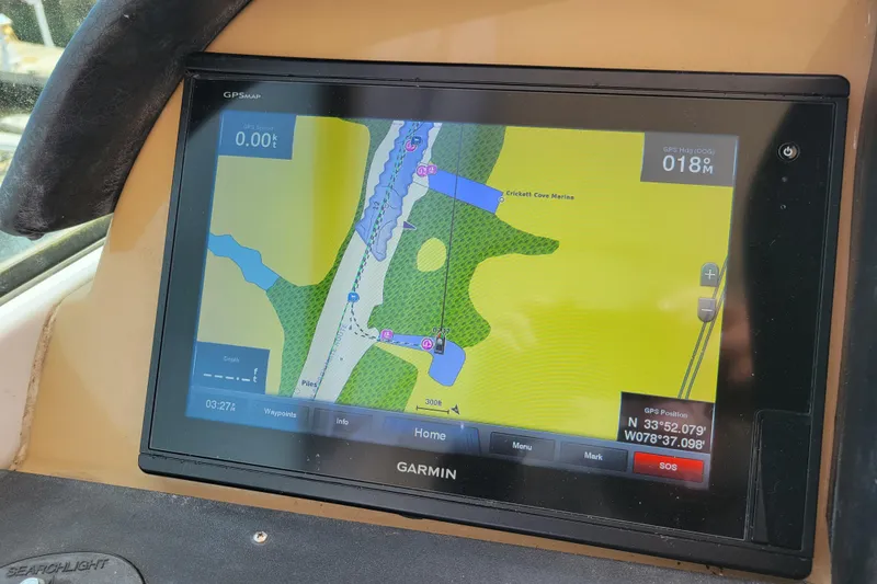 Slide: The Image of Garmin GPS display on 2001 Carver 570 Voyager Pilothouse, showing nautical map and coordinates. - 95
