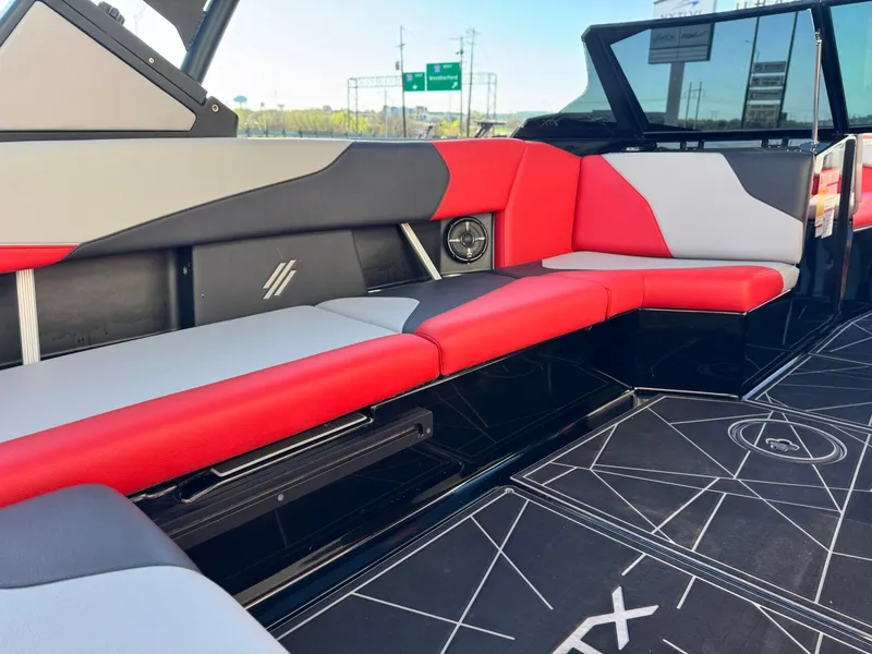Slide: The Image of Interior of 2022 ATX Surf Boats 24 Type-S with red and gray seating. - 11