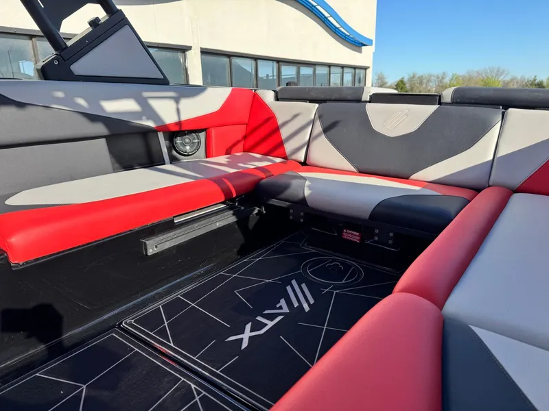 Slide: The Image of Interior of 2022 ATX Surf Boats 24 Type-S with red and gray seating. - 12