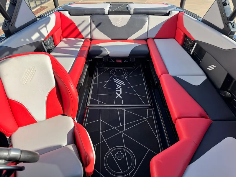 Slide: The Image of Interior of 2022 ATX Surf Boats 24 Type-S with red and gray seating. - 16