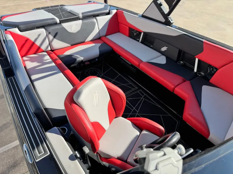 Slide: The Image of 2022 ATX Surf Boats 24 Type-S interior with red and gray seating. - 18
