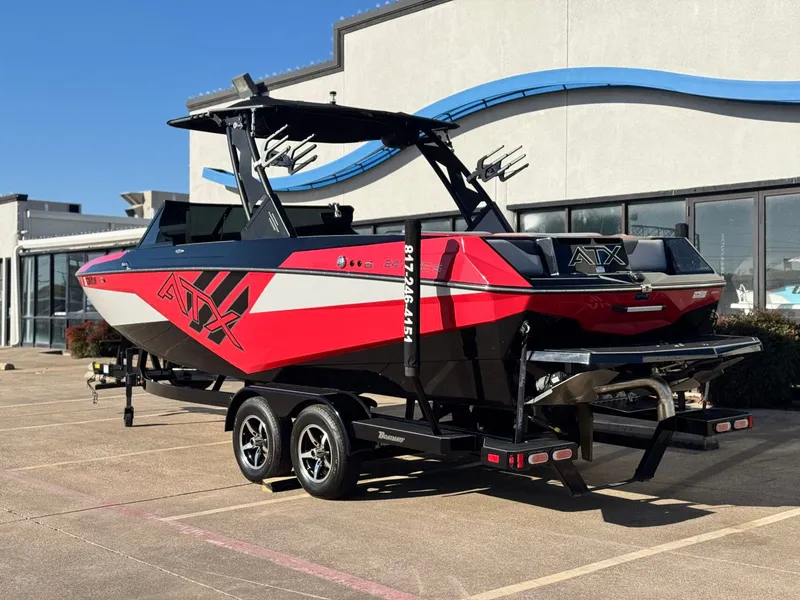 Slide: The Image of 2022 ATX Surf Boats 24 Type-S in red and black on trailer. - 3