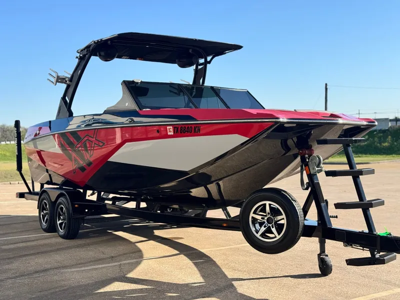 Slide: The Image of 2022 ATX Surf Boats 24 Type-S on trailer, red and black. - 6