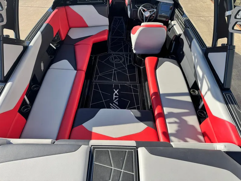 Slide: The Image of Interior of 2022 ATX Surf Boats 24 Type-S with red and gray seating. - 8