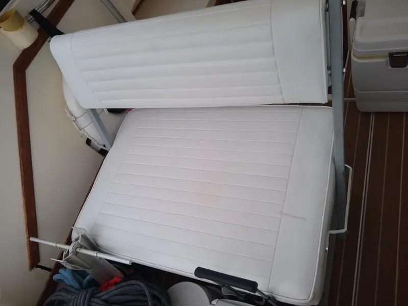 Slide: The Image of White cushioned seats on 1988 Albemarle 27 Express Fisherman boat. - 10