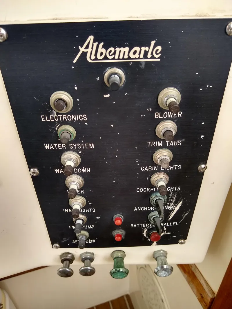 Slide: The Image of Control panel of a 1988 Albemarle 27 Express Fisherman boat with labeled switches. - 17