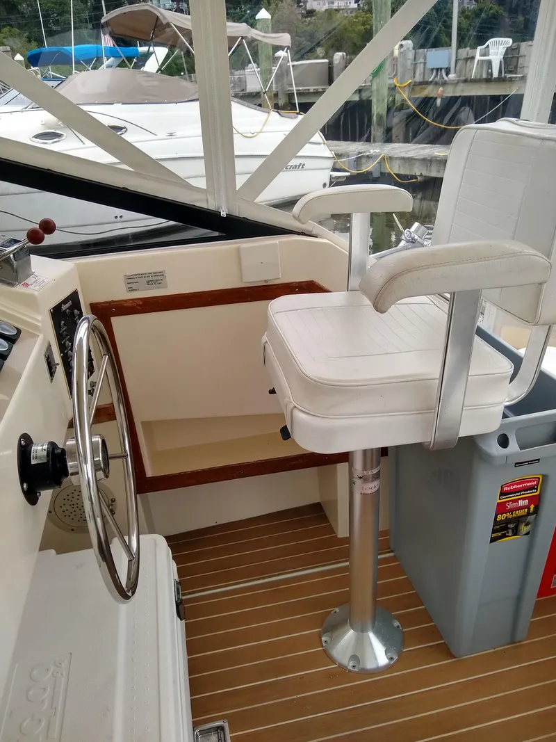 Slide: The Image of 1988 Albemarle 27 Express Fisherman boat interior with captain's chair and steering wheel. - 22