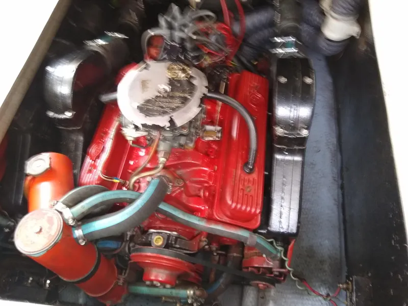Slide: The Image of 1988 Albemarle 27 Express Fisherman engine, red with visible hoses and components. - 25